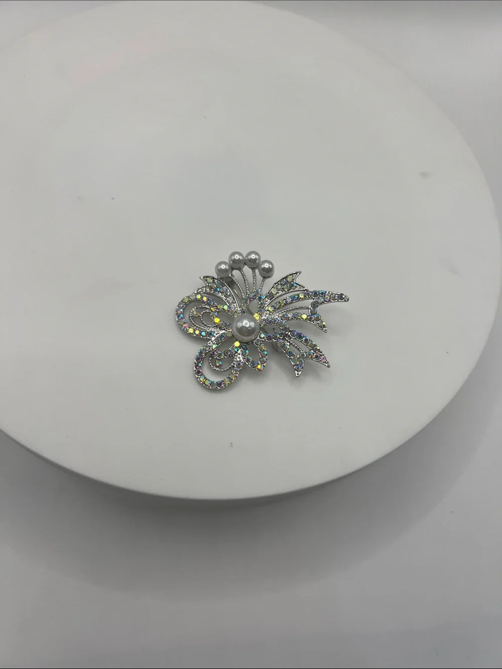 474. Silver Tone and Aurora Borealis Crystal Floral Brooch With Pearl Accents.